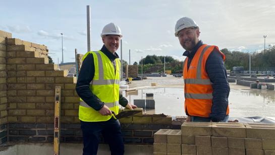 Allan Fisher And Site Manager Laying Bricks