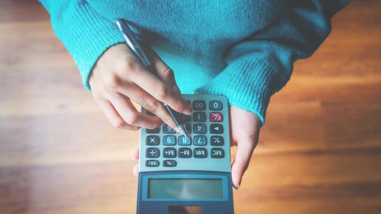 Woman Using Calculator