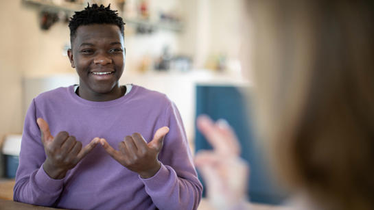Young Man Using Sign Language