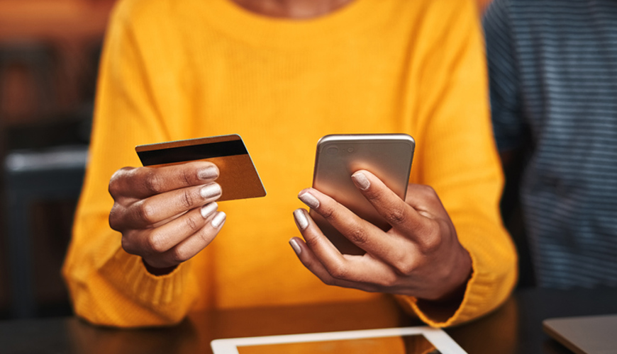 Woman Paying With Her Phone Woman Paying With Her Phone