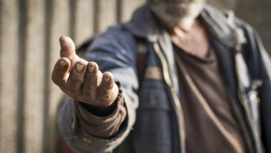 Homeless Person Holding Out His Hand