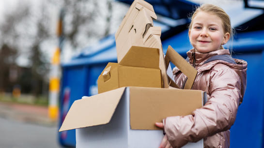 Young Girl With Cardboard Recycling