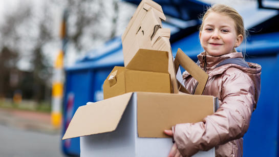 Young Girl With Cardboard Recycling Young Girl With Cardboard Recycling
