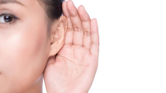 Women With Hand Cupping Ear