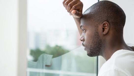 Black Man Looking Out The Window