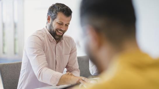 Man Smiling In Meeting