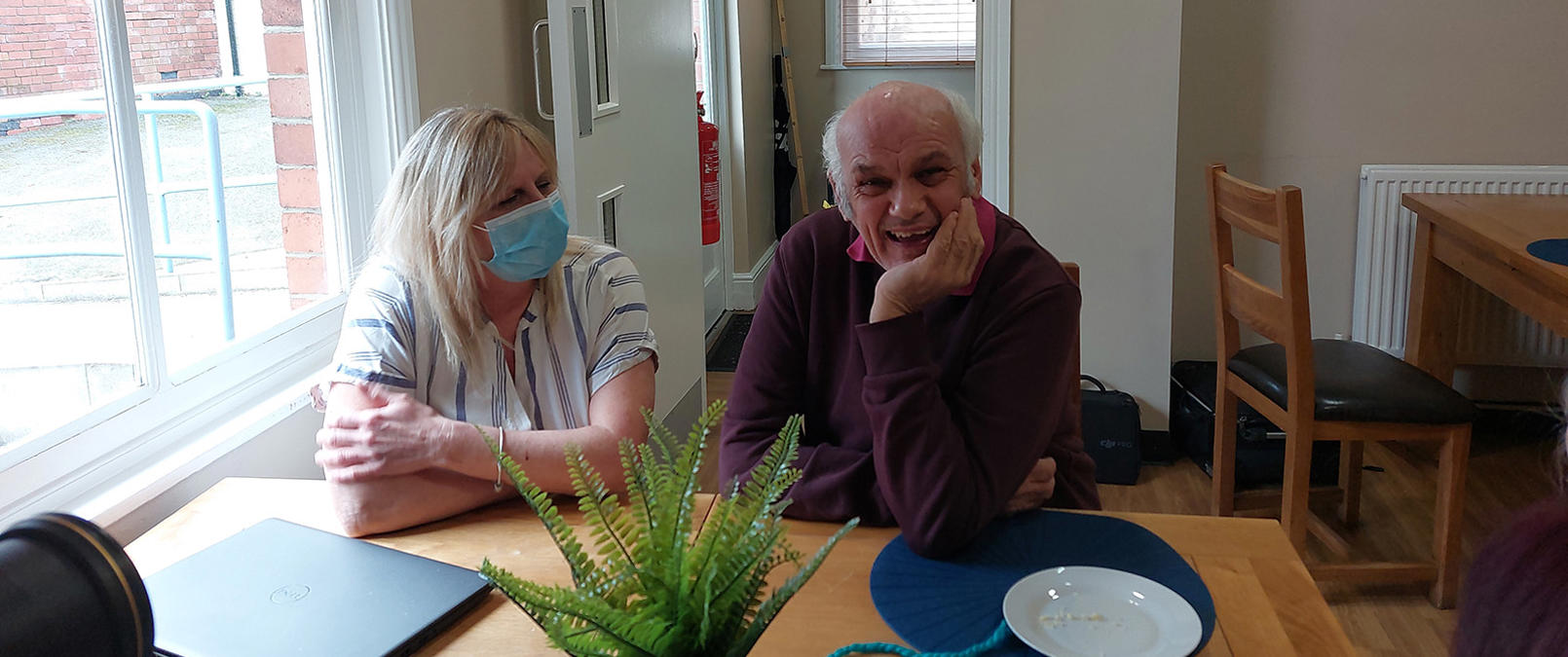 Neville talking with support worker Neville talking with support worker