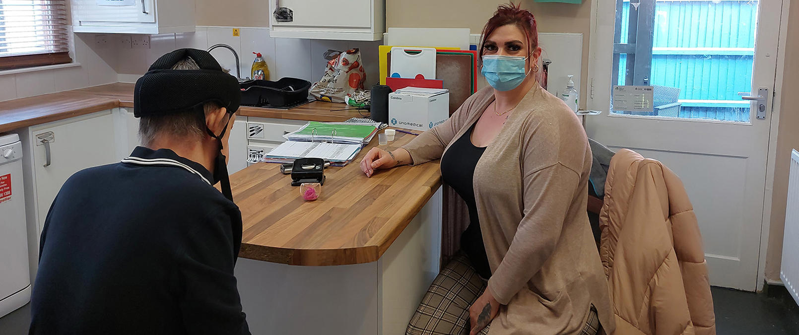 Project manager in kitchen with resident Project manager in kitchen with resident