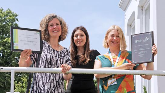 Colleagues Holding Accreditation Award