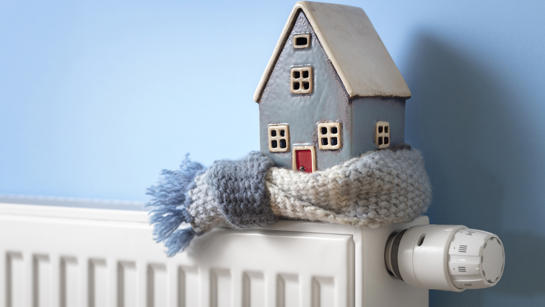 House In Scarf On Radiator Gas Safety