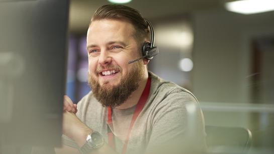Happy Customer Service Officer On Phone