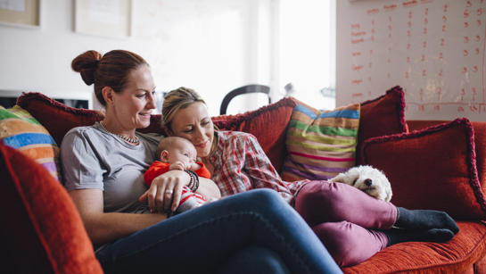Family sat on sofa
