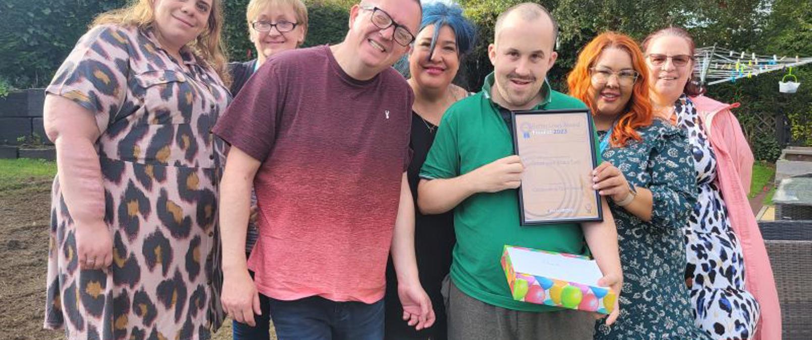 Customers Holding Award Certificate Customers Holding Award Certificate